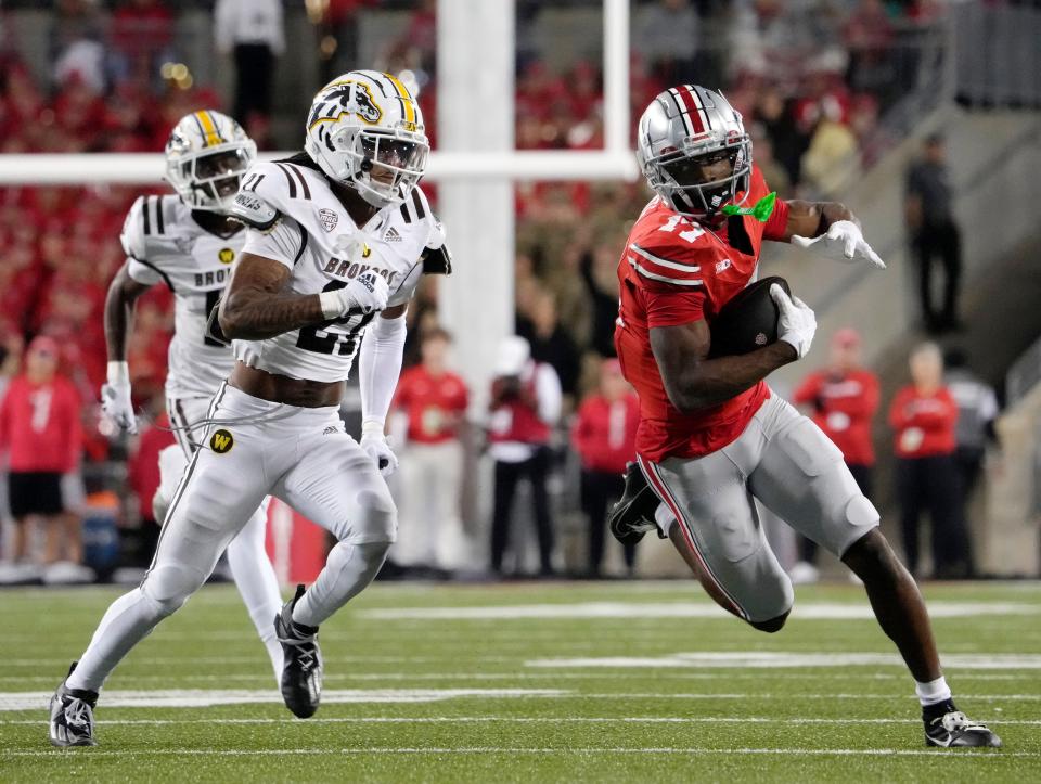 Sept. 7, 2024; Columbus, Ohio, USA;
Ohio State Buckeyes wide receiver Carnell Tate (17) is pursued by Western Michigan Broncos defensive back Josh Franklin (21) during the first half of an NCAA Division I football game on Saturday at Ohio Stadium.