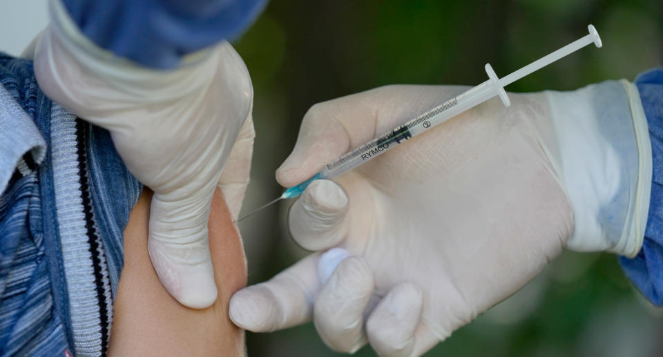 A stock image of a child receiving the Covid-19 vaccine.