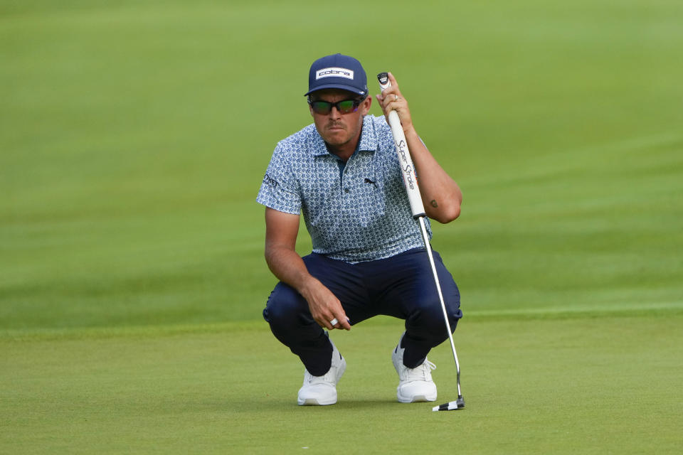 Rickie Fowler lines up a shot on the 18th green during the third round of the Travelers Championship golf tournament at TPC River Highlands, Saturday, June 22, 2024, in Cromwell, Conn. (AP Photo/Seth Wenig)
