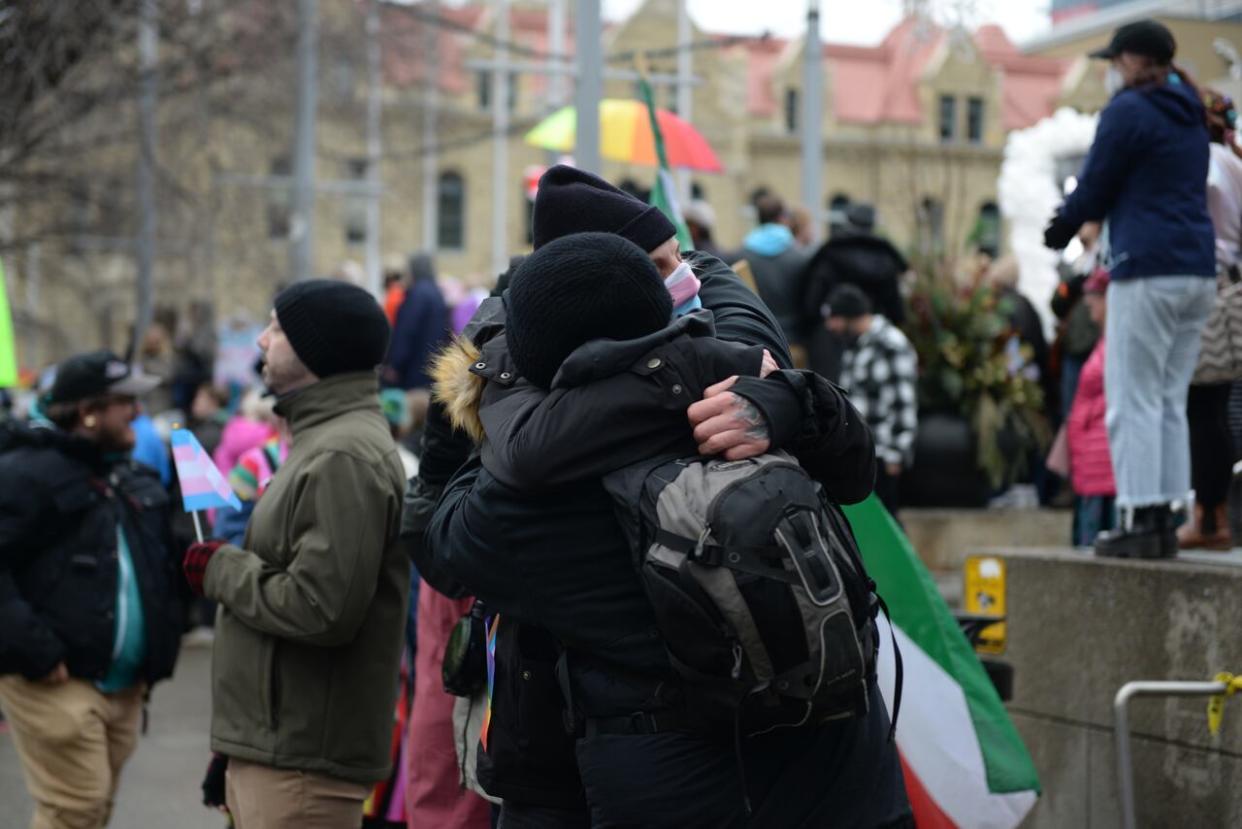 Hundreds of protesters rallied outside Calgary city hall Saturday to support the province's transgender community. (Helen Pike/CBC - image credit)