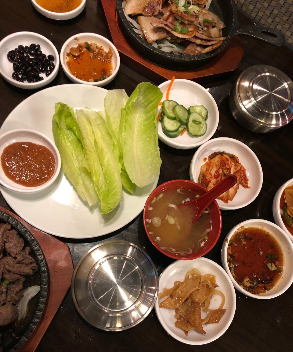 An array of banch surround main dishes at Seoul Korean Restaurant in Naples.