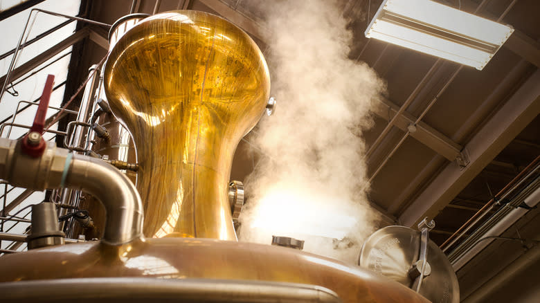 whiskey still with rising steam