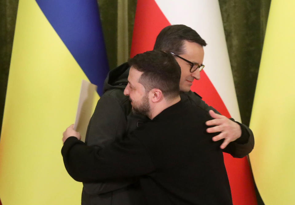 KYIV, UKRAINE - FEBRUARY 24, 2023 - President of Ukraine Volodymyr Zelenskyy (R) and Prime Minister of the Republic of Poland Mateusz Morawiecki share a hug during a joint briefing, Kyiv, capital of Ukraine. (Photo credit should read Volodymyr Tarasov / Ukrinform/Future Publishing via Getty Images)