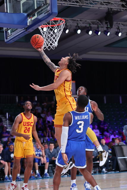 In a photo provided by Bahamas Visual Services, Southern California's Tre White shoots in front of BYU's Rudi Williams (3) during an NCAA college basketball game in the Battle 4 Atlantis at Paradise Island, Bahamas, Wednesday, Nov. 23, 2022. (Tim Aylen/Bahamas Visual Services via AP)