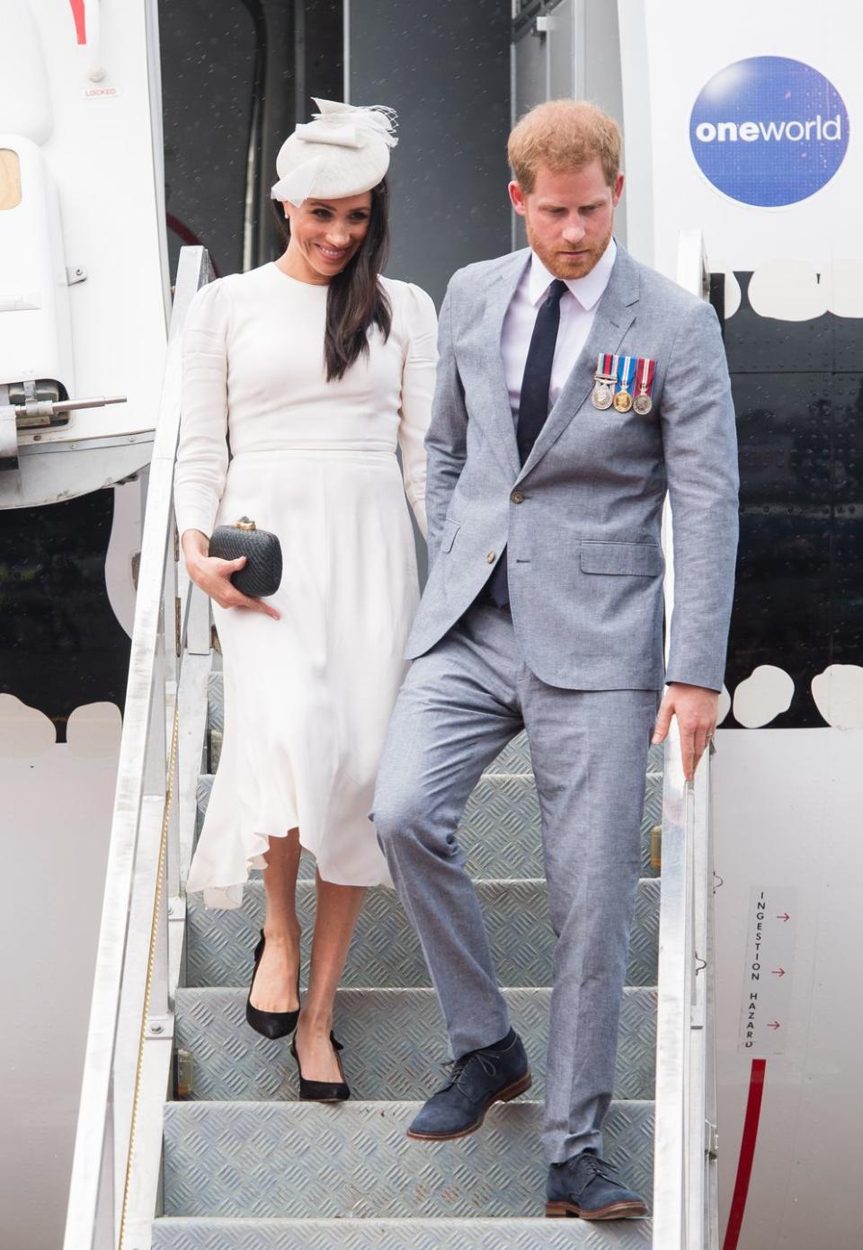 <p>Harry and Meghan step off the plane at Nausori Airport in Suva, Fiji.</p>