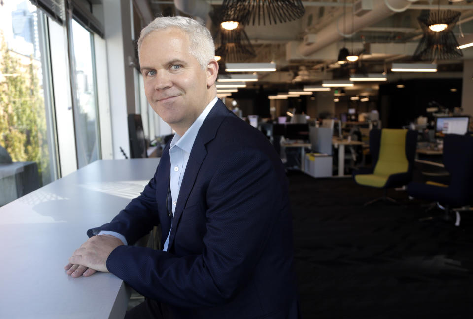 In this Tuesday, Oct. 2, 2018, photo Urban Airship product and engineering executive Mike Herrick poses at his office in Portland, Ore. The tensions between the pride Herrick takes in his profession and his parental qualms about technology tug particularly hard when he sees his daughter, Lauren, and her friends texting each other instead of talking when they're sitting 5 feet apart. “You can’t help but feel the juxtaposition,” says Herrick. “The power of this age we live in is that it has given everyone access to all this information and the ability to stay connected to people, but how do we manage it better?” (AP Photo/Don Ryan)