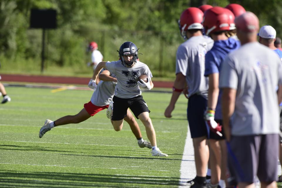 A Yale wide receiver runs near the sideline during a 7-on-7 scrimmage against St. Clair at East China Stadium in East China Township on Monday, July 25, 2022.