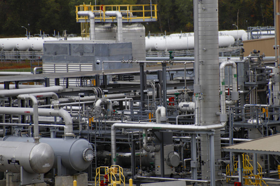 In this Oct. 17, 2019, photo, tanks and pipes move product through the MarkWest Bluestone Gas Processing Plant in Evans City, Pa. President Donald Trump has aligned with Pennsylvania's natural gas industry, but his support for the industry in the nation's No. 2 natural gas state may not yield the expected political boost in what is perhaps the nation's premier presidential battleground state. In parts of the state critical to his path to victory, opposition to fracking is growing and calls for getting tough on the industry are popular. (AP Photo/Keith Srakocic)