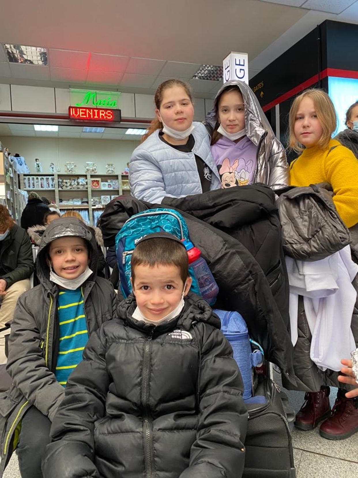 The children, pictured here, waiting to board a plane to Isreal. (Courtesy The International Fellowship of Christians and Jews)