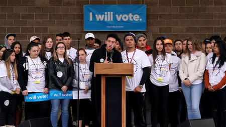 Marjory Stoneman Douglas High School survivor Carlos "Carlitos" Rodriguez speaks as teens kick off a voter registration rally, a day ahead of the 19th anniversary of the massacre at Columbine High School, in Littleton, Colorado, U.S., April 19, 2018. REUTERS/Rick Wilking