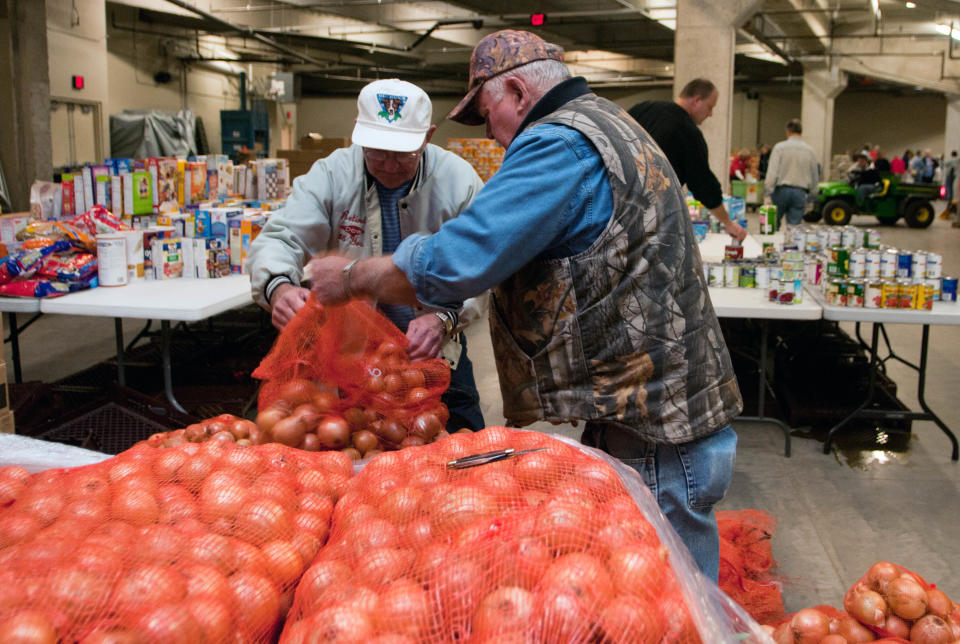 FILE - In this Friday, Sept. 21, 2012, file photo, Karl Hock, left, and Duane Varner unload onions for the food distribution at the Food Bank of Eastern Michigan, in Midland, Mich. A second month of sharp gains in gasoline costs drove wholesale prices higher in September. But outside of the surge in energy, prices were well contained. Wholesale prices rose 1.1 percent in September following 1.7 percent gain in August which had been the largest one-month gain in more than three years, the Labor Department said Friday, Oct. 12, 2012. (AP Photo/The Bay City Times, Yfat Yossifor) LOCAL TV OUT; LOCAL INTERNET OUT