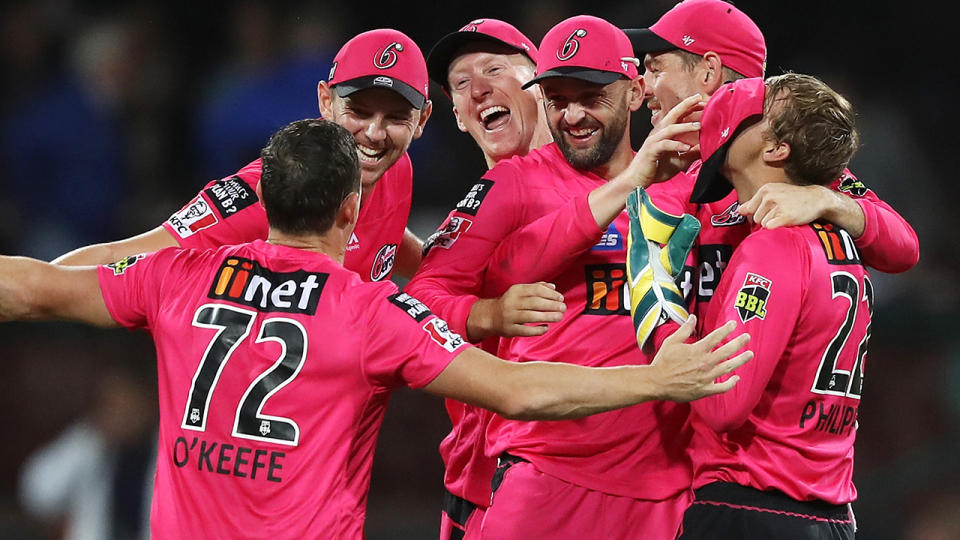 The Sydney Sixers are pictured celebrating winning the 2019/20 Big Bash League.