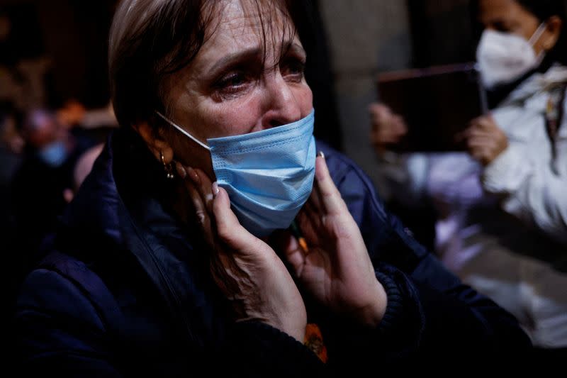 FILE PHOTO: A Ukrainian woman reacts upon arriving in Madrid