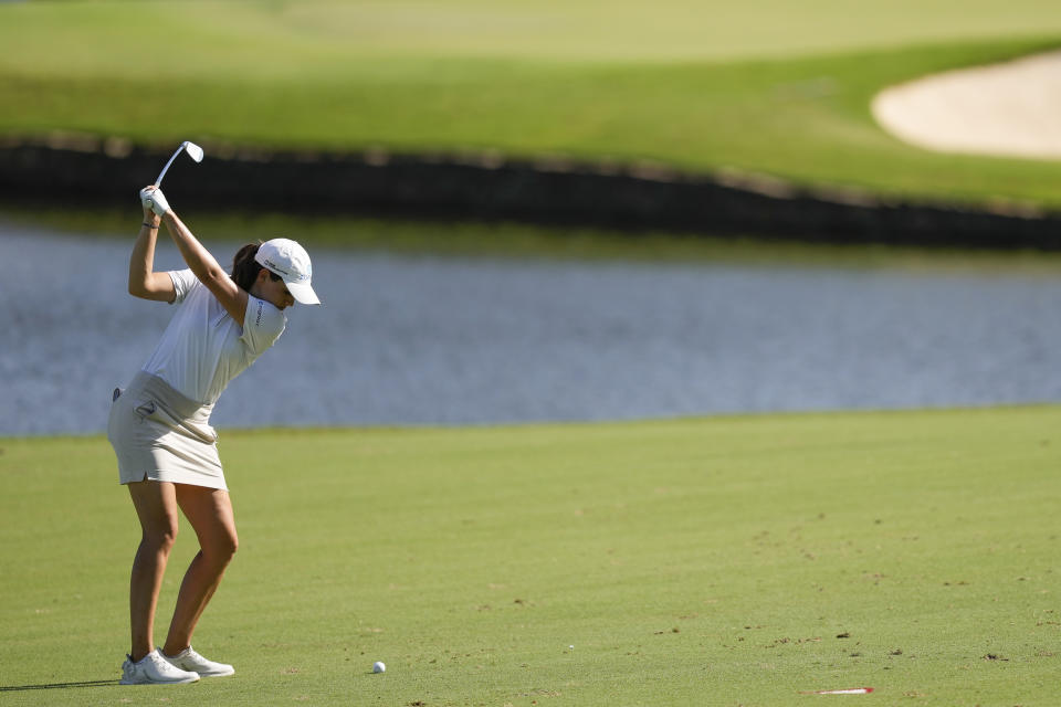 Albane Valenzuela, of Switzerland, hits from the fairway on the 18th hole during the third round of the Chevron Championship women's golf tournament at The Club at Carlton Woods on Saturday, April 22, 2023, in The Woodlands, Texas. (AP Photo/David J. Phillip)