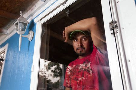 Crime victim Hugo Reyes, who applied for a United States U visa based on a violent attack by a man he did not know, is pictured at his home in Albuquerque, New Mexico, October 10, 2014. REUTERS/Eric Draper