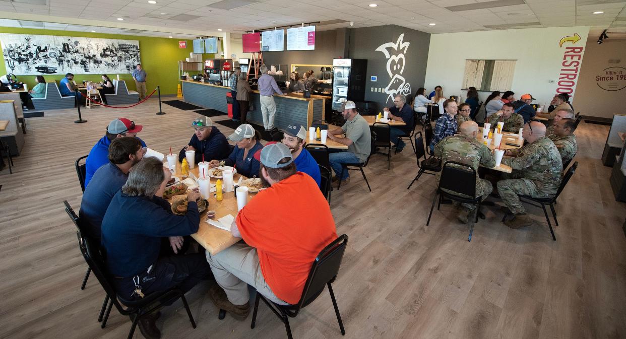 With almost every table occupied, a steady stream of customers come in to order during lunch hour at the newly opened Basil’s/Rooster’s combo restaurant in Flowood on Tuesday, April 23. Rooster's, foreground, and Basil's, background, occupy one space in the Flowood strip mall behind the theater.