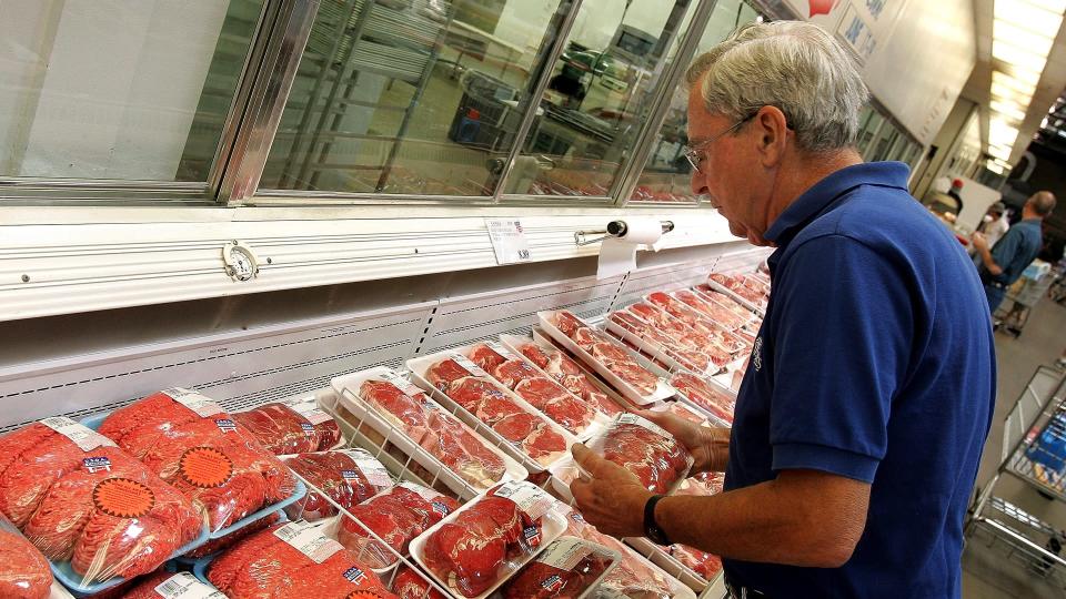 NILES, IL - JUNE 16:  Ray Carey shops the premium brand Kirkland Signature meat section at a Costco store June 16, 2005 in Niles, Illinois.