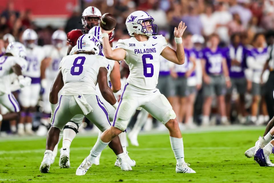 Furman quarterback Tyler Huff throws a pass against South Carolina in a September football game.