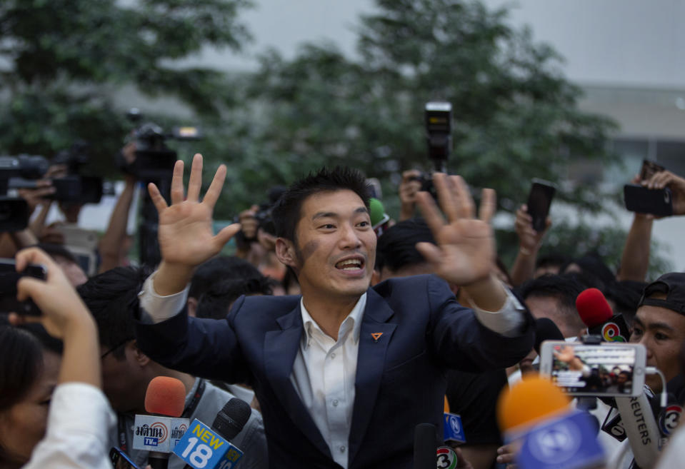 Thanathorn Juangroongruangkit leader of the anti-military Future Forward Party gestures as he leaves Constitutional Court in Bangkok, Thailand, Wednesday, Nov. 20, 2019. Thailand's Constitutional Court ruled Wednesday that Thanathorn violated election laws and cannot keep his seat in Parliament. (AP Photo/Gemunu Amarasinghe)