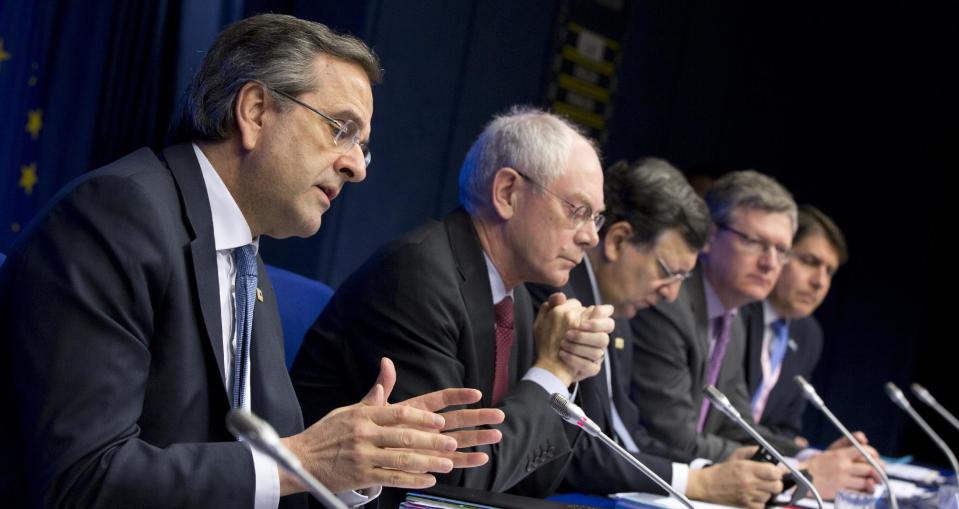 Greek Prime Minister Antonis Samaras, left, speaks during a media conference at an EU summit in Brussels on Thursday, March 20, 2014. The EU Commission president wants a two-day summit of European Union leaders to center on boosting the fledgling government in Kiev rather than focus exclusively on sanctions against Russia over its annexation of Ukraine’s Crimea peninsula. EU Commission President Jose Manuel Barroso said Thursday the 28 nations need to bolster the new authorities in Ukraine with political commitments and economic aid. From second left, European Council President Herman Van Rompuy and European Commission President Jose Manuel Barroso. (AP Photo/Virginia Mayo)