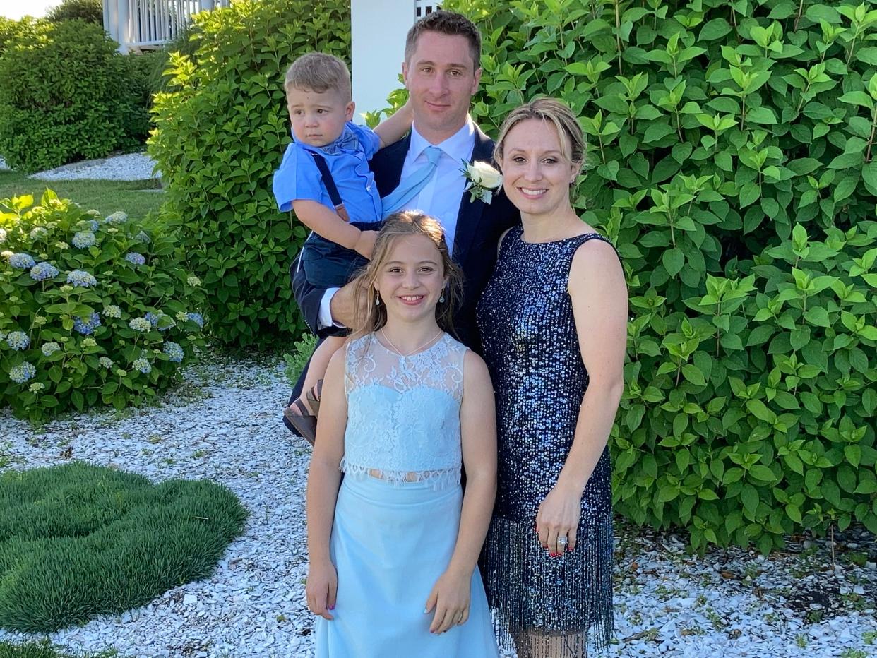 Megan Maynard with husband Jay and her two living children.