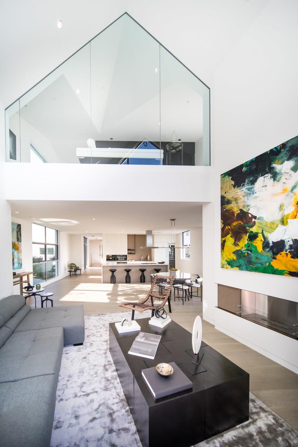 The living room inside of the units enjoy the space that the tall ceilings provide.