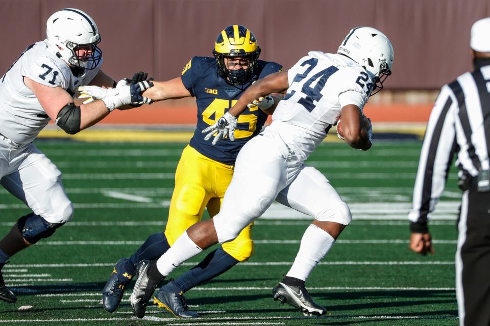 Michigan linebacker Adam Shibley tries to tackle Penn State running back Keyvone Lee during the second half of Michigan's 27-17 loss at Michigan Stadium on Saturday, Nov. 28, 2020.