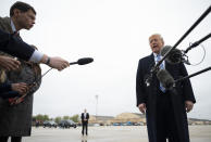 President Donald Trump speaks to the press before boarding Air Force One in Andrews Air Force Base, Md., Saturday, March 28, 2020. Trump is en route to Norfolk, Va., for the sailing of the USNS Comfort, which is headed to New York. (Jim Watson/Pool Photo via AP)