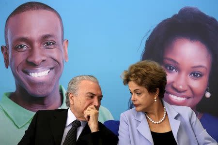 Brazil's Vice President Michel Temer talks with Brazil's President Dilma Rousseff during a ceremony for the Investment Program in Electricity at the Planalto Palace in Brasilia, August 11, 2015. REUTERS/Ueslei Marcelino