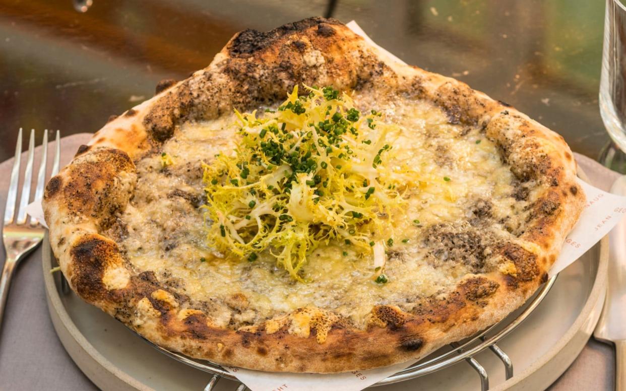 Life is sweet, if you've got the dough: the black truffle and fontina pizza (£29) at Jean-Georges at The Connaught - Andrew Crowley