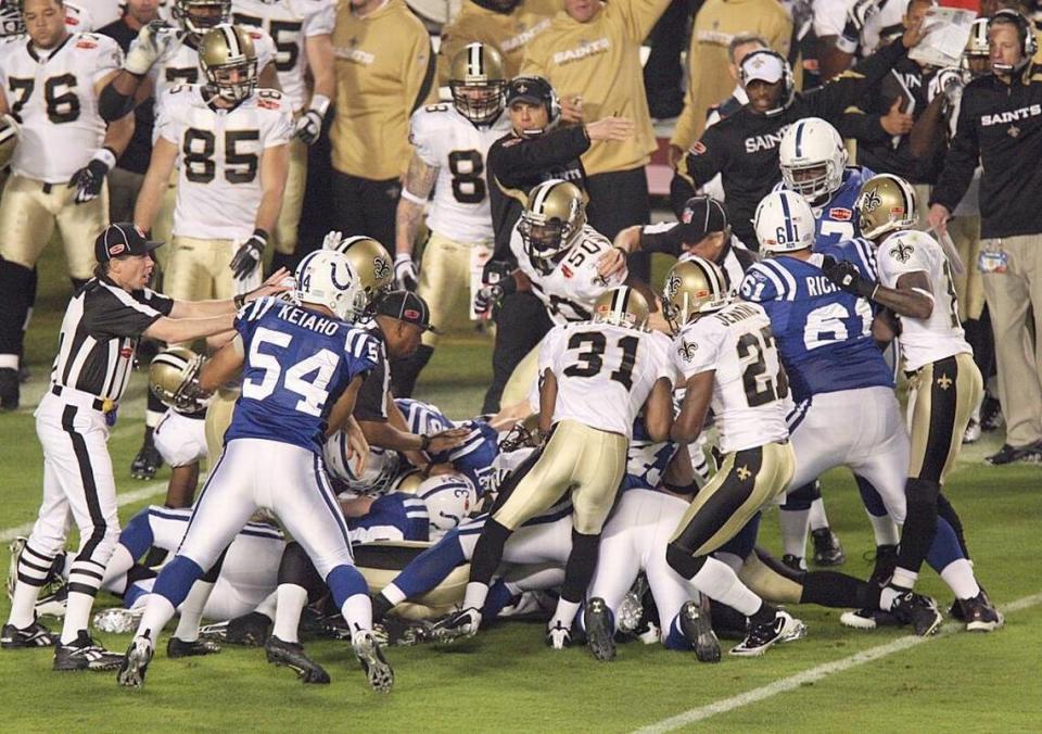 The Colts and Saints battle for the onside kick with which the Saints opened the second half of Super Bowl XLIV. New Orleans’ recovery swung the scoring pendulum of the game at Sun Life Stadium.