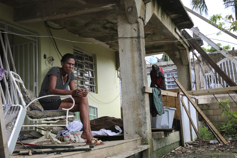 Juana Ferrera sits on the porch of her home in Valle Hill,&nbsp;Can&oacute;vanas, Puerto Rico. (Photo: Carolina Moreno/HuffPost)