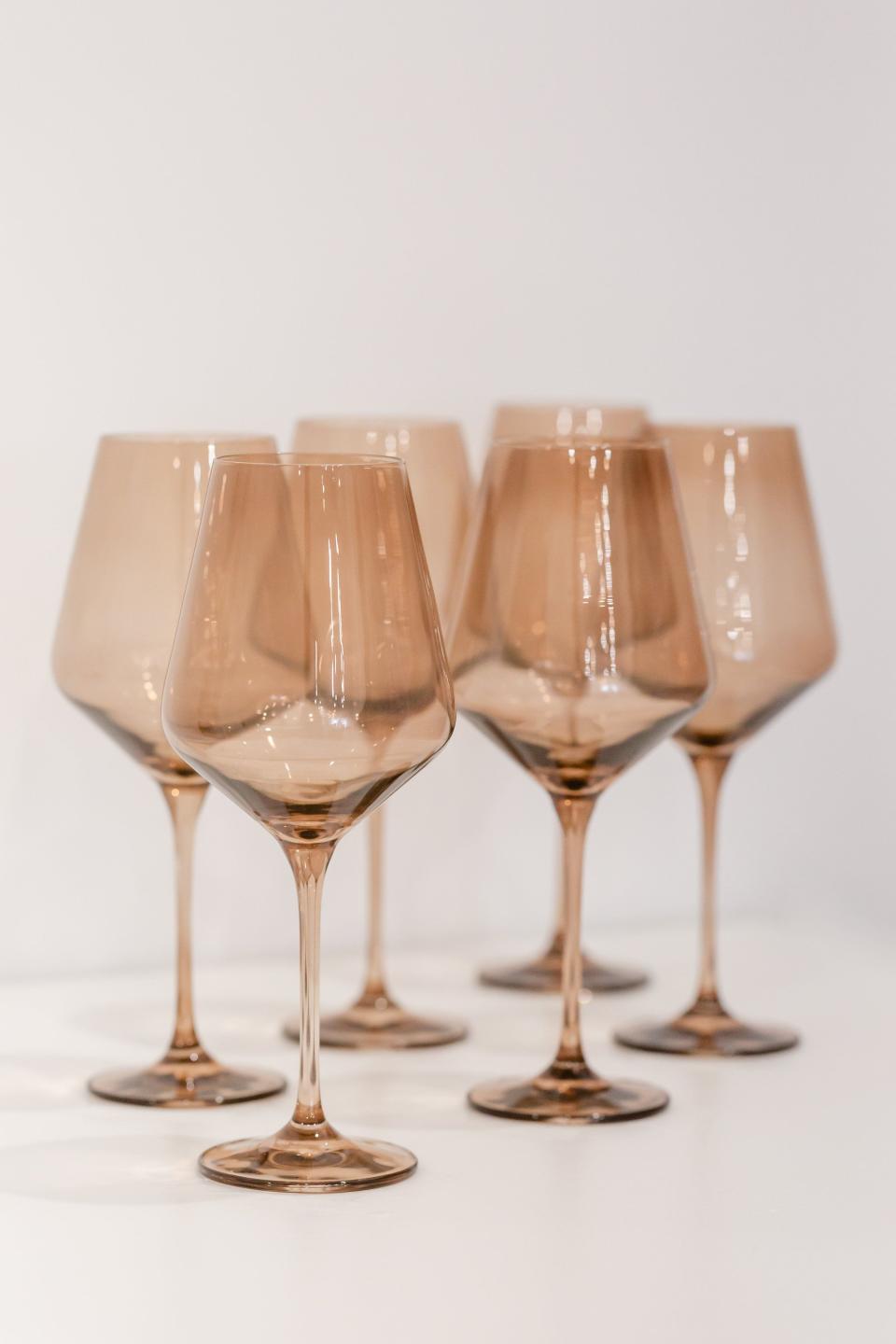 <p><strong>Estelle Colored Glass</strong></p><p>estellecoloredglass.com</p><p><strong>$175.00</strong></p><p><a href="https://www.estellecoloredglass.com/collections/glassware/products/estelle-colored-wine-stemware-smoke" rel="nofollow noopener" target="_blank" data-ylk="slk:Shop Now;elm:context_link;itc:0;sec:content-canvas" class="link ">Shop Now</a></p><p>Estelle's colored-glass stemware, available in a set of six, is a great gift for the friend who loves to host. </p>