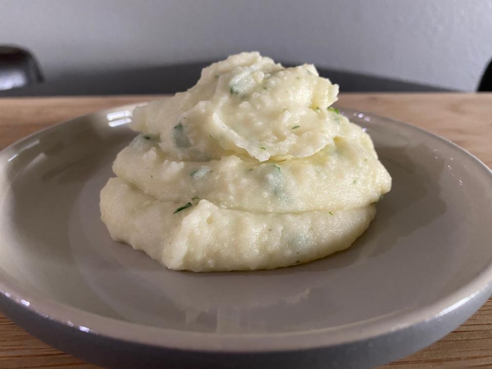 garlic mashed potatoes in a pile on a plate