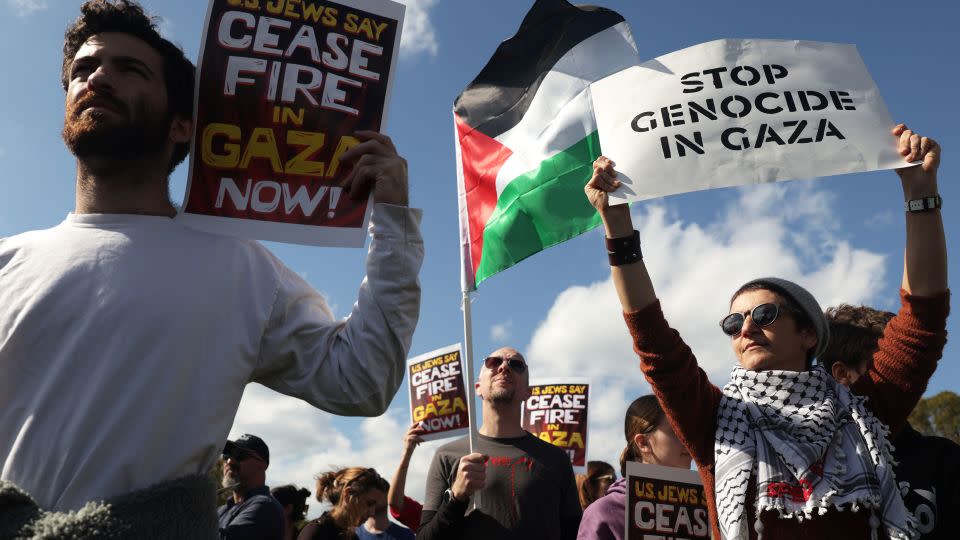 Jewish peace activists carried the Palestinian flag and wore keffiyehs as they marched on Capitol Hill. - Alex Wong/Getty Images