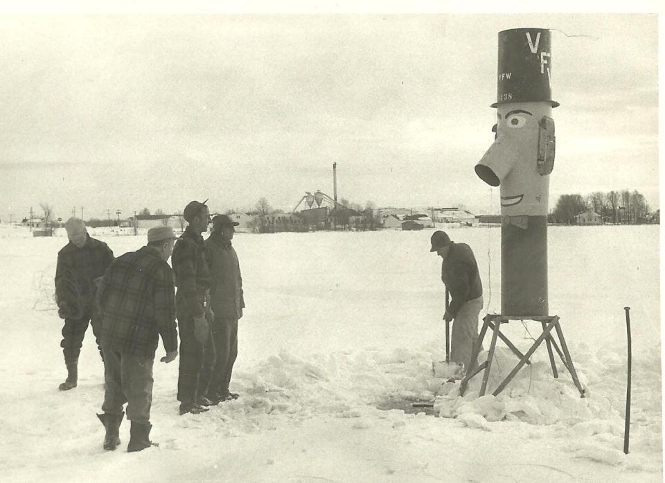 A group of men install the original Iron Mike out on the ice of White Lake. The ice out contest originated in the 1950s with Norman "Mike" Berg, a World War II and Korean War veteran who became a civic leader and volunteer.