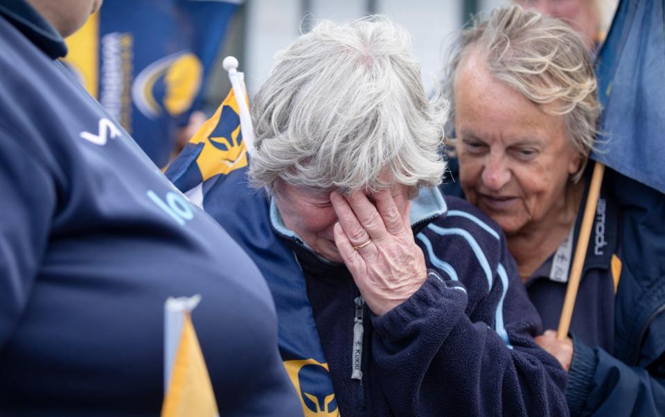 Fans gather outside Worcester Warriors rugby club as the announcement is made that the club is to be suspended from the league. Christine Morgan is overcome with emotion. - Andrew Fox for The Telegraph