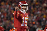 Kansas City Chiefs quarterback Patrick Mahomes signals teammates during the first half of the NFL AFC Championship playoff football game against the Cincinnati Bengals, Sunday, Jan. 29, 2023, in Kansas City, Mo. (AP Photo/Ed Zurga)