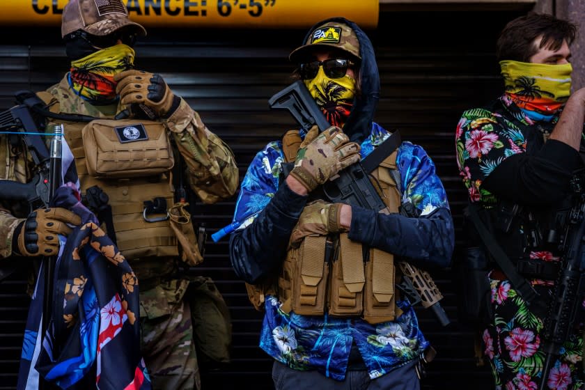 RICHMOND, VA. -- JANUARY 18, 2021: Boogaloo Boys armed with weapons and flags rally during Lobby Day in Richmond, United States, on Monday Jan. 18, 2021. (Marcus Yam / Los Angeles Times)