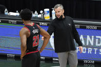 Chicago Bulls head coach Billy Donovan, right, talks to forward Thaddeus Young during the second half of an NBA basketball game against the Memphis Grizzlies in Chicago, Friday, April 16, 2021. (AP Photo/Nam Y. Huh)