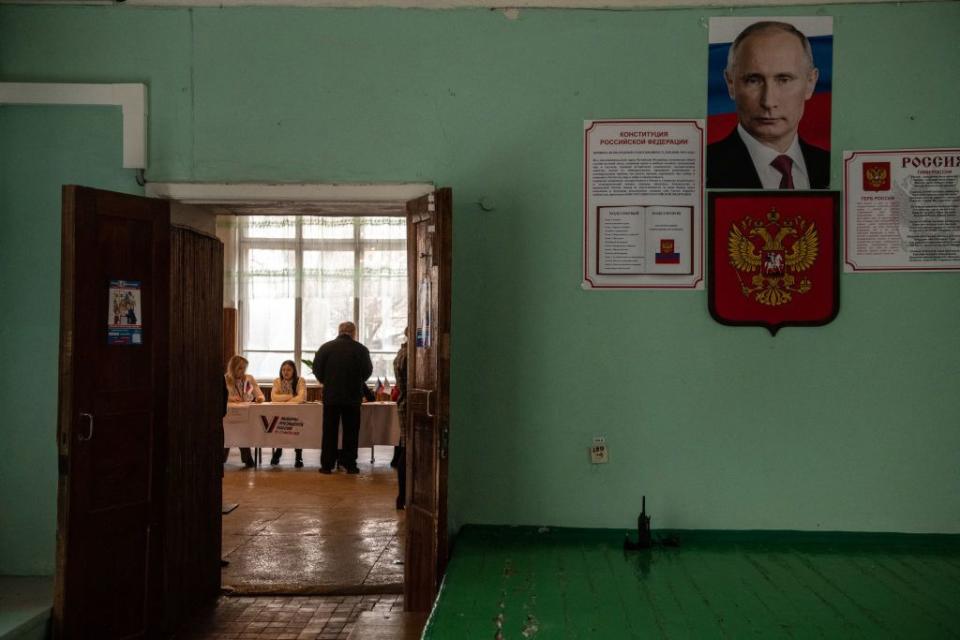 A man registers to vote in Russia's presidential election at a polling station in occupied Donetsk, Russian occupied part of Ukraine, on March 16, 2024. (Stringer/AFP via Getty Images)