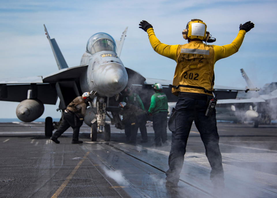 Sailors conduct flight operations aboard the U.S. Navy Nimitz-class aircraft carrier USS Carl Vinson in the western Pacific Ocean May 2, 2017. Picture taken May 2, 2017. U.S. Navy/Mass Communication Specialist 2nd Class Sean M. Castellano/Handout via REUTERS