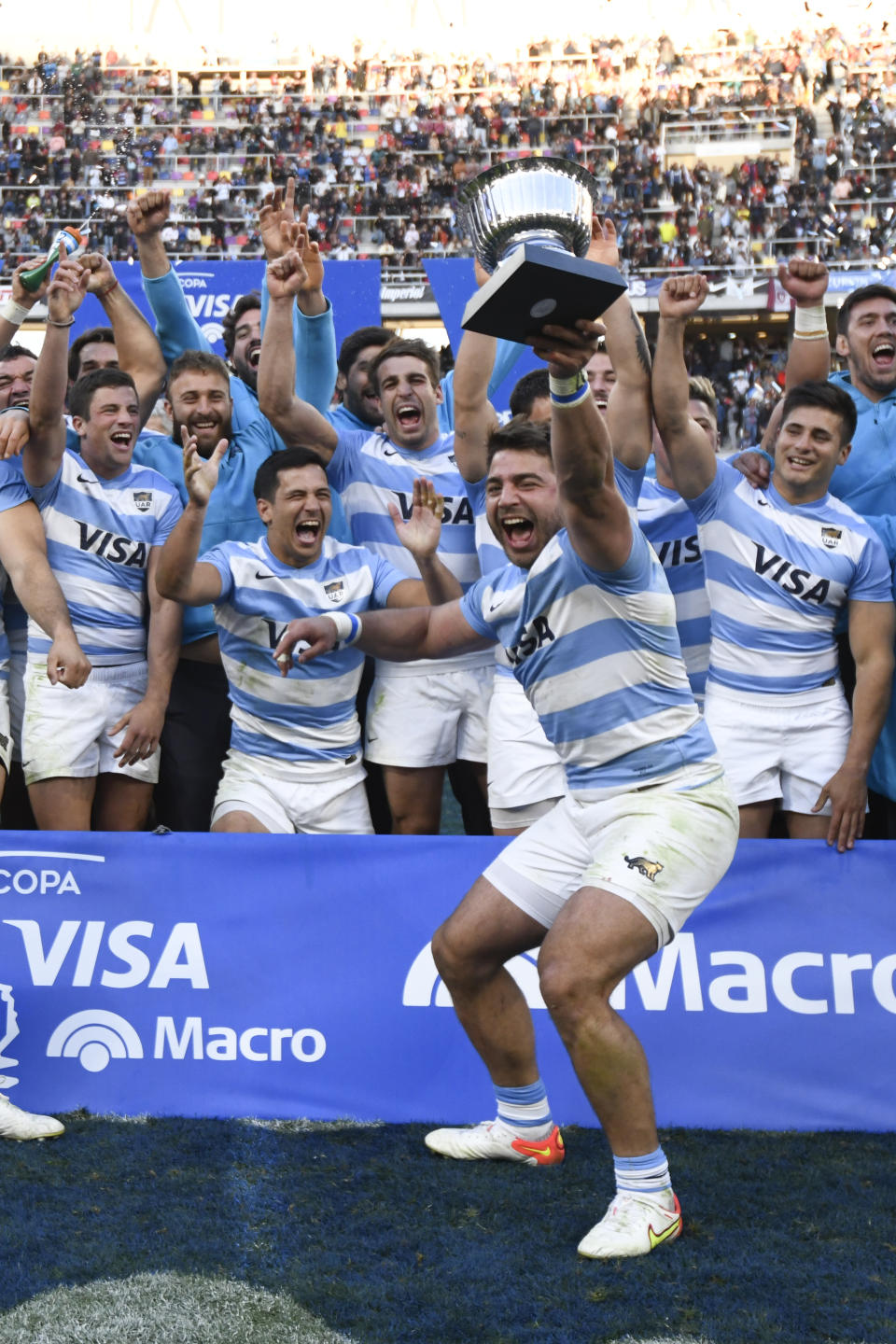 Argentina's Los Pumas Rodrigo Bruni celebrates holding the trophy after his team won a test match against Scotland, in Santiago Del Estero, Argentina, Saturday, July 16, 2022. (AP Photo/Gustavo Garello)