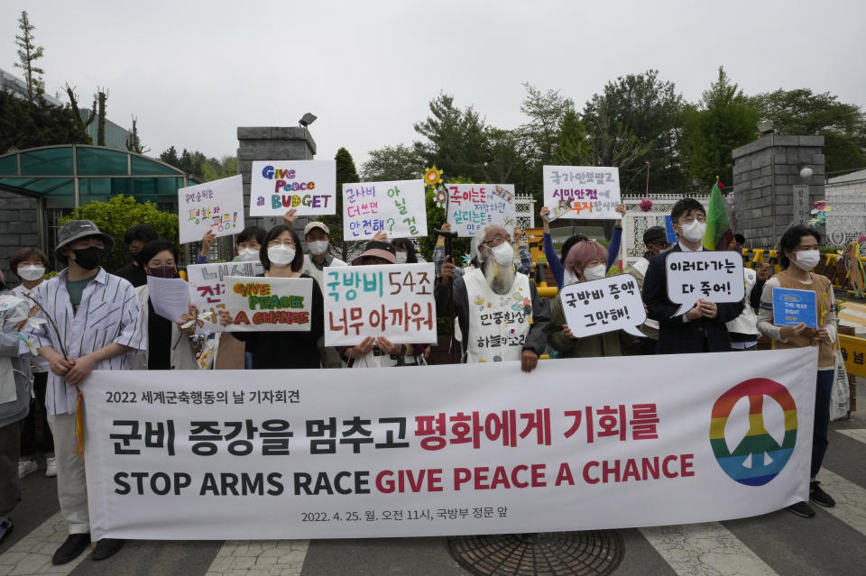 South Korean protesters stage a rally to mark Global Day of Action on Military Spending in front of the Defense Ministry in Seoul, South Korea, Monday, April 25, 2022. North Korea began a much-anticipated military parade in its capital on Monday marking the 90th anniversary of its army's founding, with outside experts saying it was likely to display powerful missiles and other weapons capable of targeting the United States and its allies. (AP Photo/Ahn Young-joon)