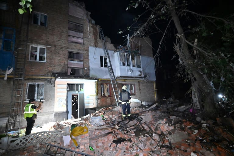 Rescuers operate in an apartment building hit by a Russian missile attack in Kharkiv early on May 31, 2024, amid the Russian invasion in Ukraine. Russian strikes killed three people in the Ukrainian city of Kharkiv, authorities said today, after the United States had authorised Kyiv to use American weapons to hit targets inside Russia in defence of the region. (SERGEY BOBOK)