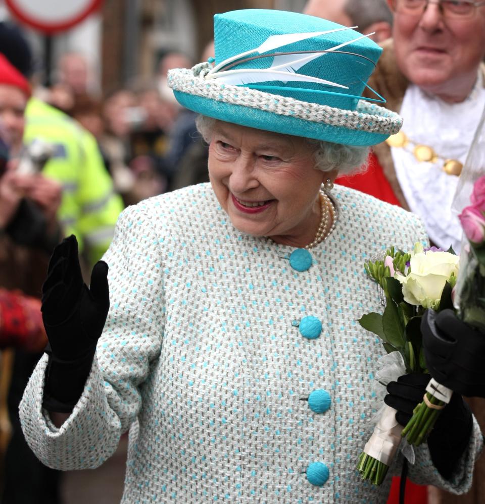 NORFOLK, ENGLAND - FEBRUARY 6: Queen Elizabeth II waves as she leaves Kings Lynn Town Hall on February 6, 2012 in Norfolk, England. Today is Accession Day, with the Queen celebrating 60 years to the day since she became Monarch. (Photo by Chris Radburn - WPA Pool/Getty Images)