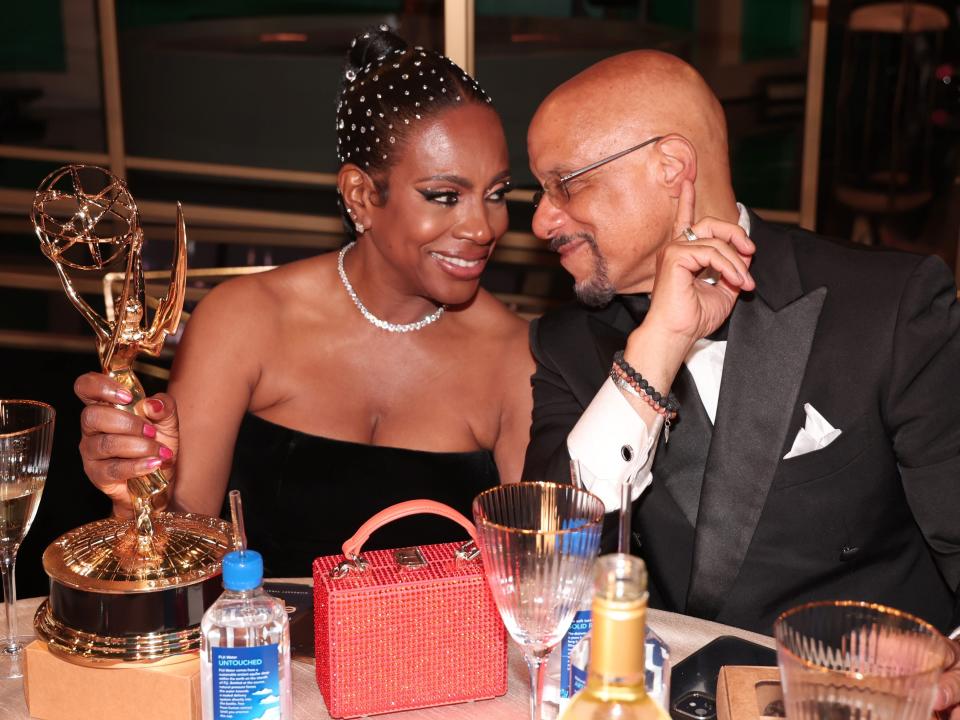 sheryl lee ralph, holding her emmy, looking lovingly at her husband, vincent hughes