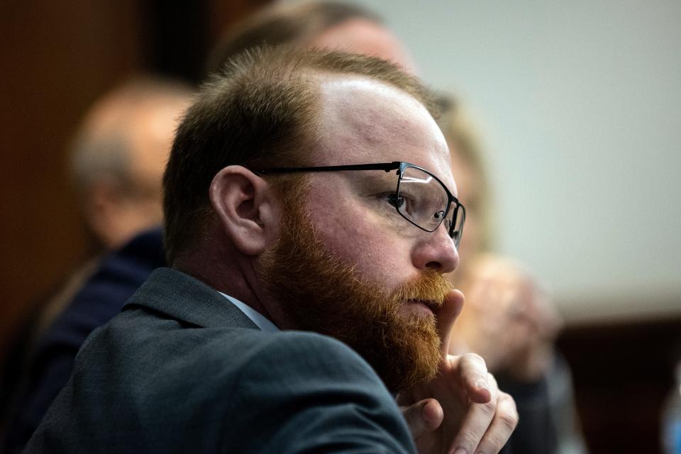 Defendant Travis McMichael watches a video clip the jury asked to see as part of their deliberation during the trial of McMichael, his father Greg McMichael, and neighbor, William "Roddie" Bryan, Wednesday, Nov. 24, 2021, in the Glynn County Courthouse in Brunswick, Ga.