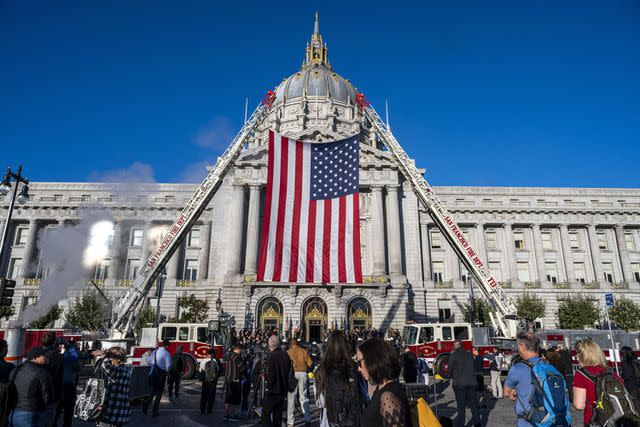 <p>David Paul Morris/Bloomberg via Getty</p> An American flag hangs outside San Francisco City Hall before Sen. Dianne Feinstein lies in state on Oct. 4, 2023