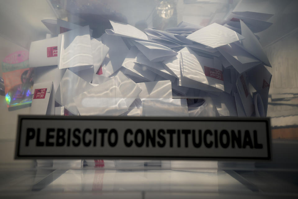 Ballots sit on a box after the polls closed in Santiago, Chile, Sunday, Dec. 17, 2023. For the second time in as many years, Chileans vote in a referendum on whether to replace the current constitution which dates back to the military dictatorship of Gen. Augusto Pinochet. (AP Photo/Esteban Felix)